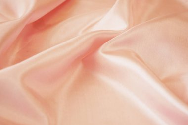 Açık pembe kumaş dokusu, ipek arkaplan, yüzey, yakın plan