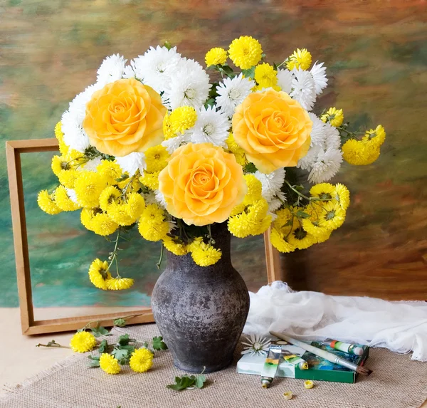 Still life with autumn flowers and roses, paints collection and frame