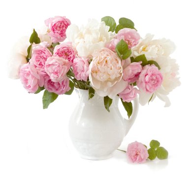 Rich bunch of peonies and tea roses in vase isolated on white