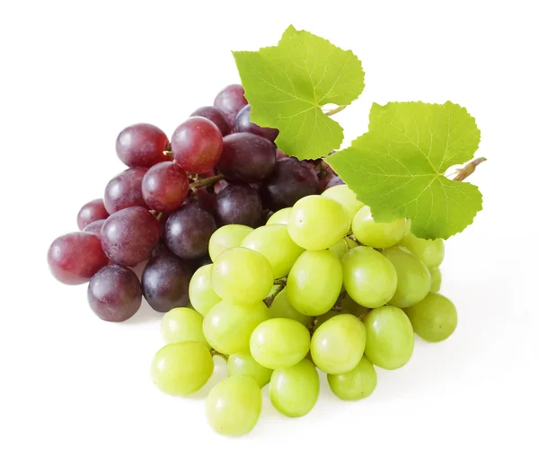 Fresh red and green grapes with leaves. Isolated on white Stock Picture