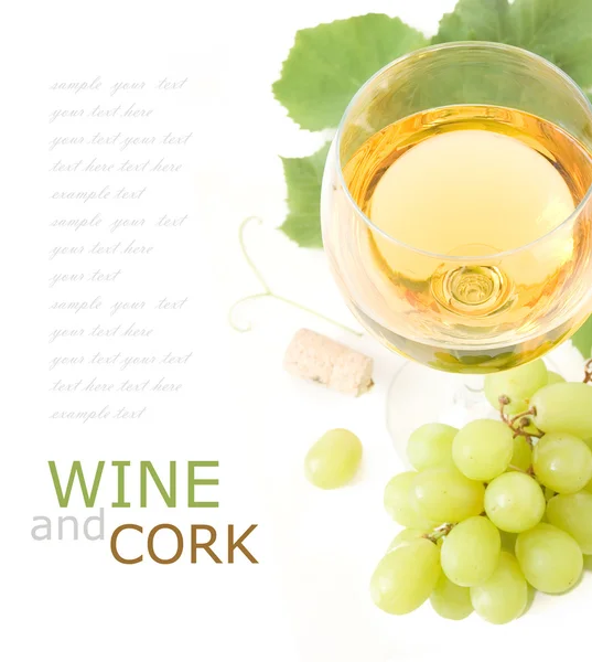 Glass of wine,grapes, leaves and bottle cork isolated on white background with sample text — Stock Photo, Image