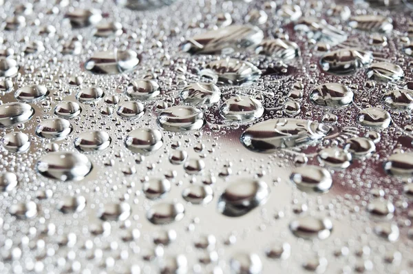 Gotas de água no fundo de metal — Fotografia de Stock