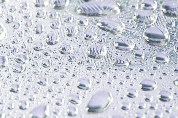 Gotas de água no fundo de metal — Fotografia de Stock