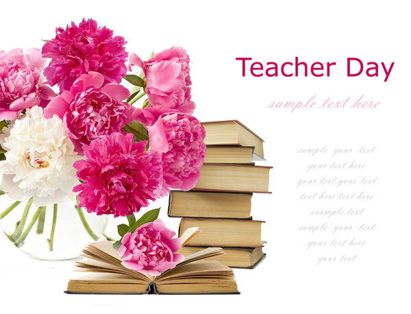 Teacher day (still life with bunch of peonies and pile of books isolated on white)