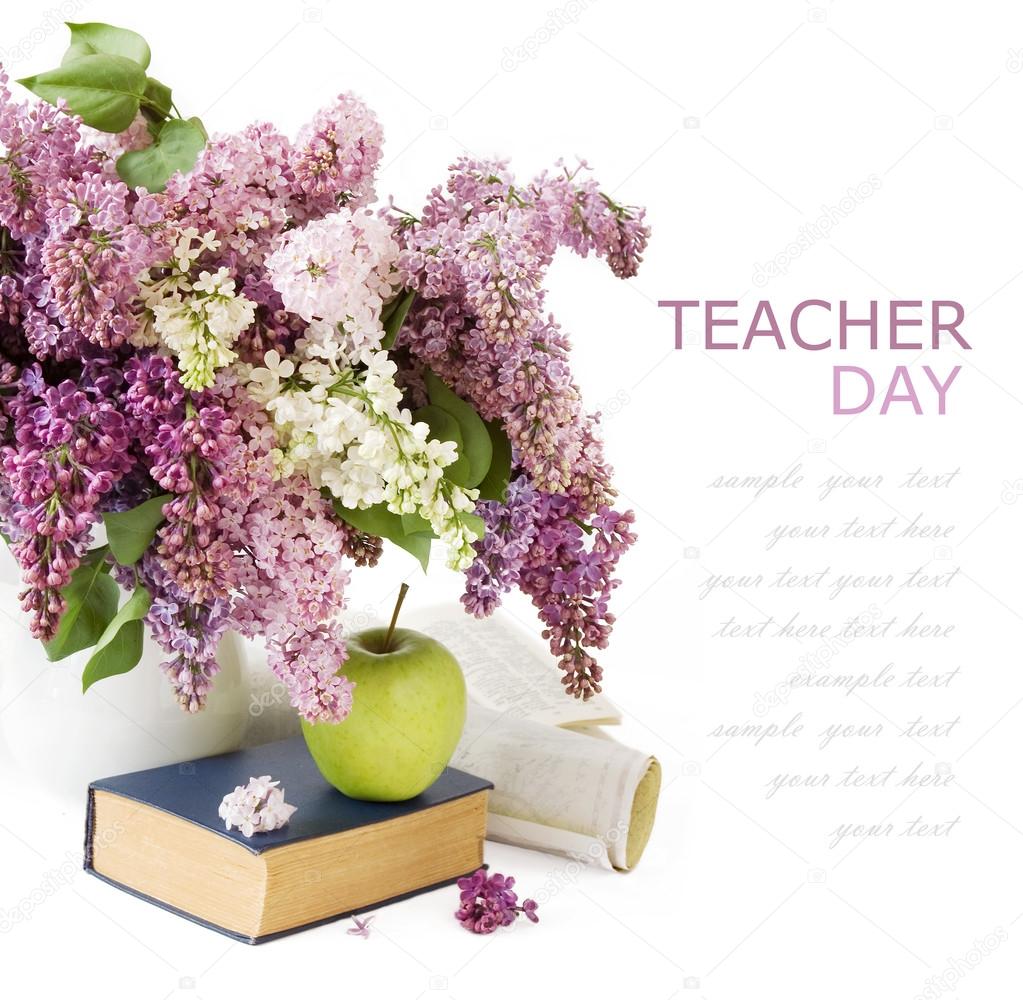 Teacher Day (still life with huge bunch of lilac flowers, books,apple and map isolated on white background with sample text)