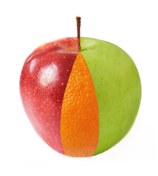 Creative apple combined from red, green apples and orange half isolated on white. Concept