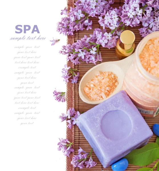 Flowers spa (fresh flowers,spa salt, zen stones) on a wooden bord (with easy removable text) — Stock Photo, Image