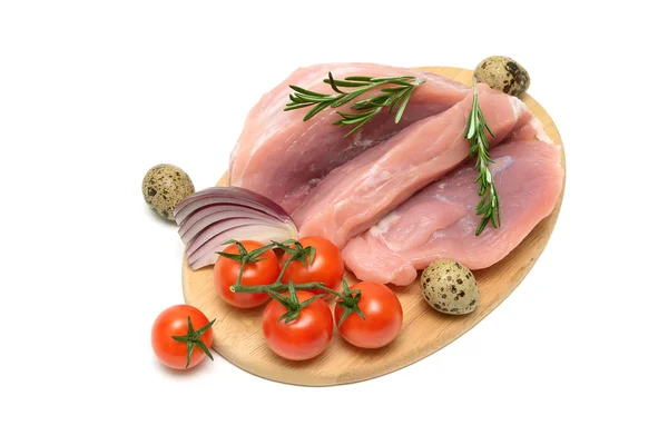 Pork, vegetables and quail eggs on a cutting board — Stock Photo, Image