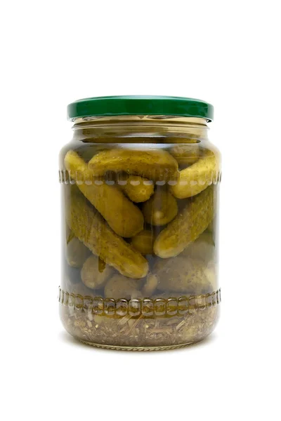 Pickled cucumbers in a glass jar on a white background — Stock Photo, Image