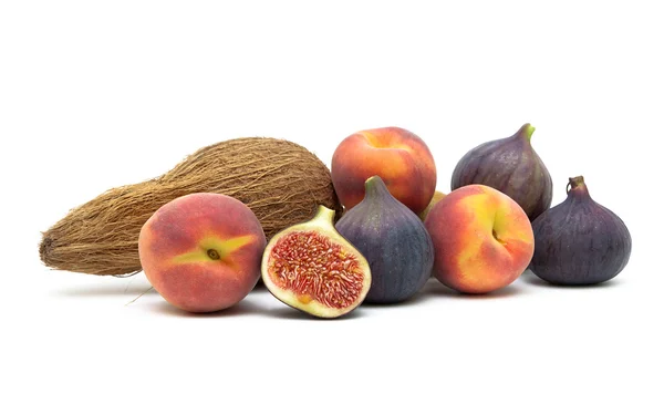 Figs, peaches and coconut isolated on white background — Stock Photo, Image