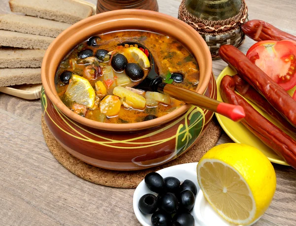 Russian thistle soup on wooden background close-up. — Stock Photo, Image