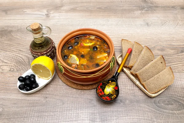 Russian thistle soup on wooden background. — Stock Photo, Image