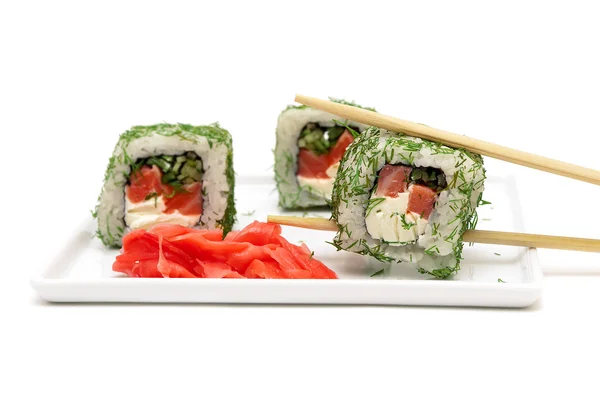 Rolls and pickled ginger on a plate on a white background — Stock Photo, Image