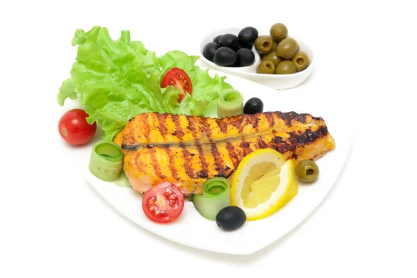 Piece of baked salmon with lemon and vegetables on the plate on — Stock Photo, Image