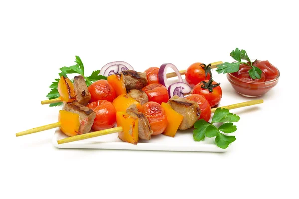 Skewers of meat with vegetables on a white background — Stock Photo, Image