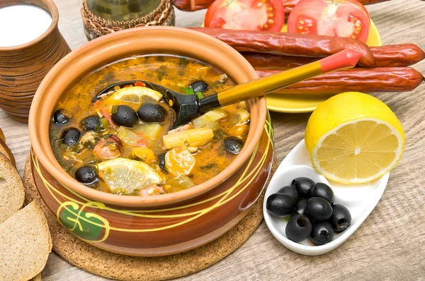 Dish of russian hodgepodge soup and other food. — Stock Photo, Image