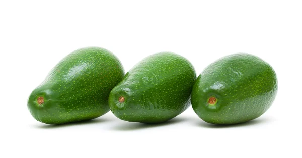 Drei reife Avocado isoliert auf weißem Hintergrund — Stockfoto