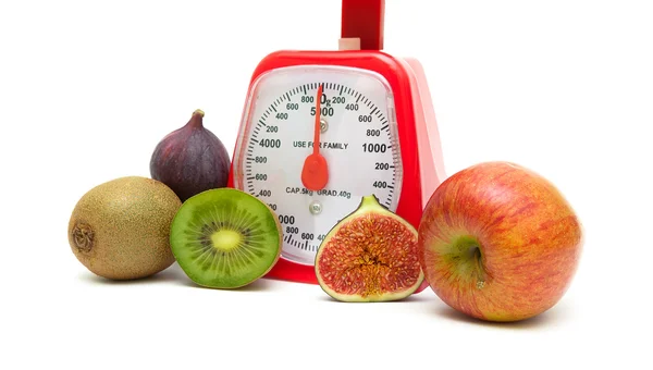 Ripe fruits and kitchen scales isolated close up on white backgr — Stock Photo, Image