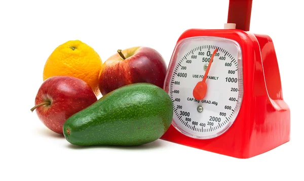 Fruit and kitchen scales isolated on white background — Stock Photo, Image