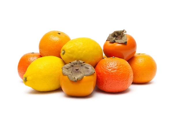 Persimmons, tangerines and lemons isolated on white background — Stock Photo, Image