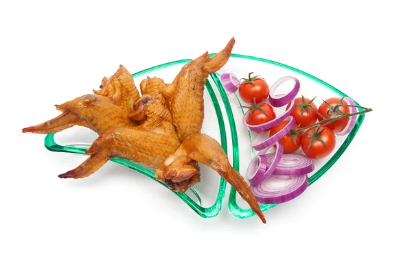 Smoked chicken wings, onion and cherry tomatoes close-up on a wh — Stock Photo, Image