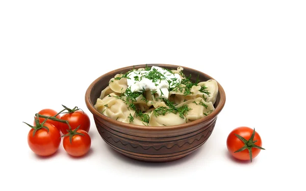 Bolinhos com nata azeda e tomates cereja em um backgro branco Imagem De Stock