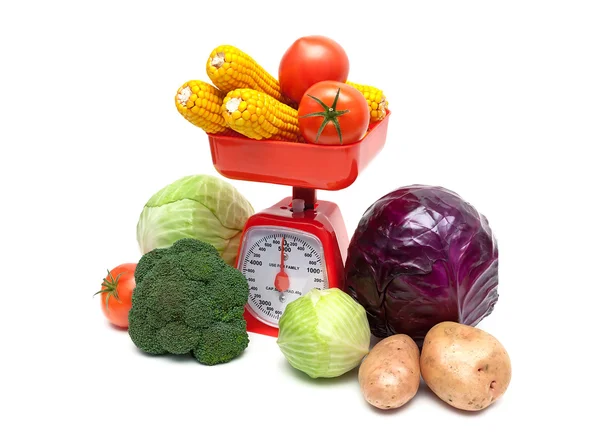 Vegetables and kitchen scales on a white background — Stock Photo, Image