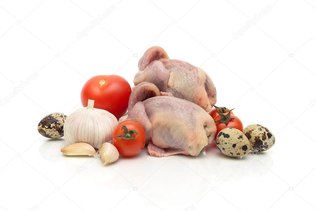 quail carcasses, eggs and vegetables on a white background