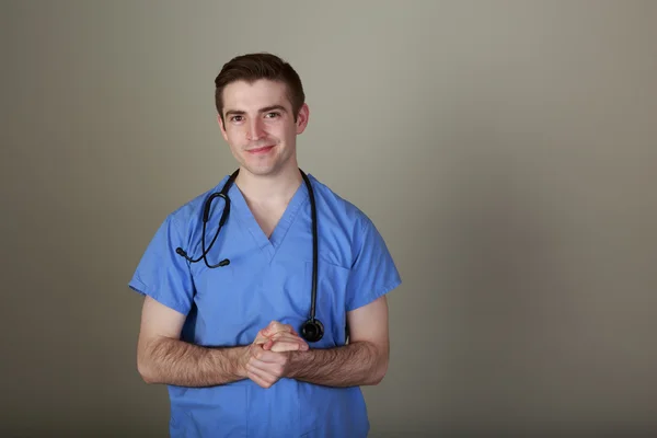 Confident Young Doctor in Scrubs — Stock Photo, Image