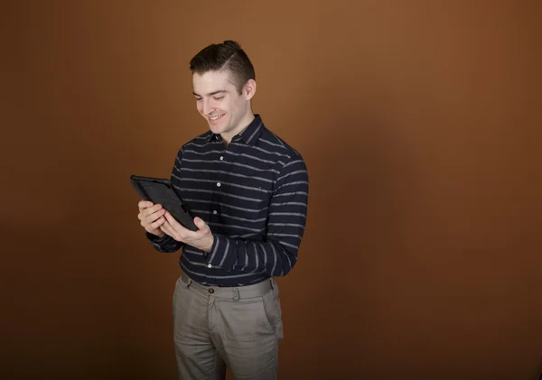 Young man with tablet — Stock Photo, Image