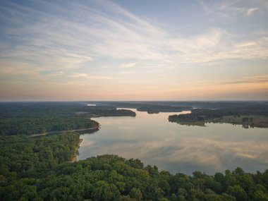 Drone shot of Sunrise over a lake in the Midwest USA with reflection