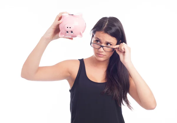 Jovem mulher com porquinho banco — Fotografia de Stock