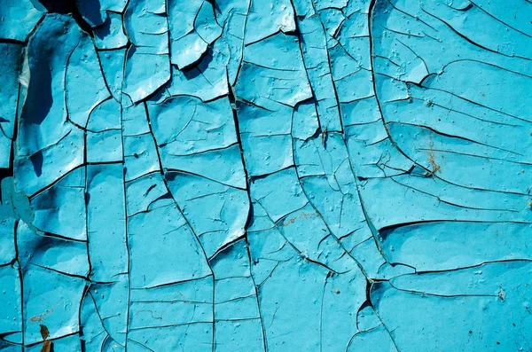 Gebarsten blauwe verf close-up gestructureerde achtergrond — Stockfoto