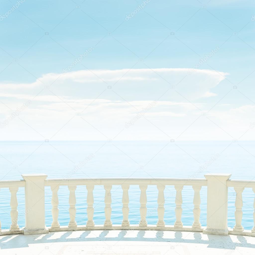 balcony over sea and light clouds in blue sky