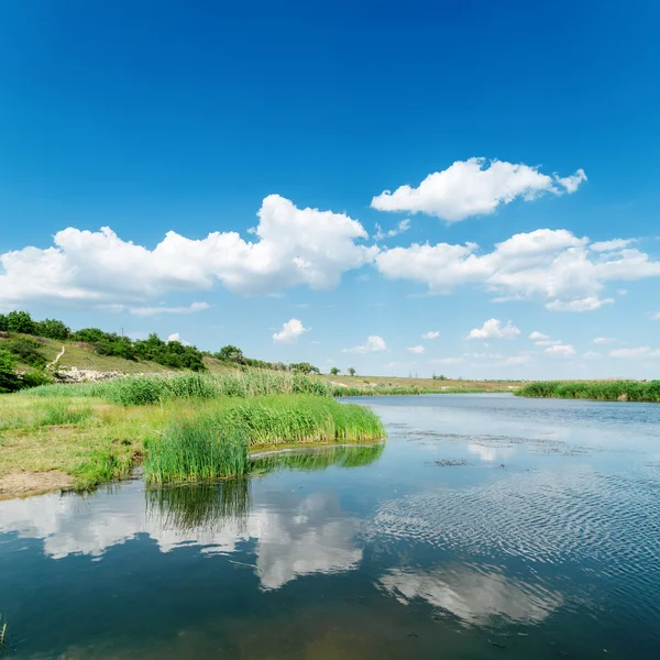 White clouds reflect in river — Stock Photo, Image