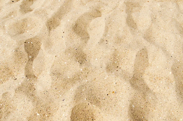 Arena amarilla en la playa como fondo — Foto de Stock