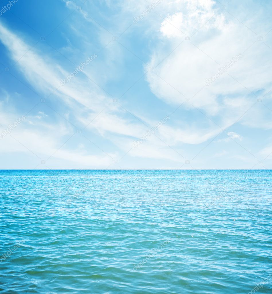 white clouds over blue sea