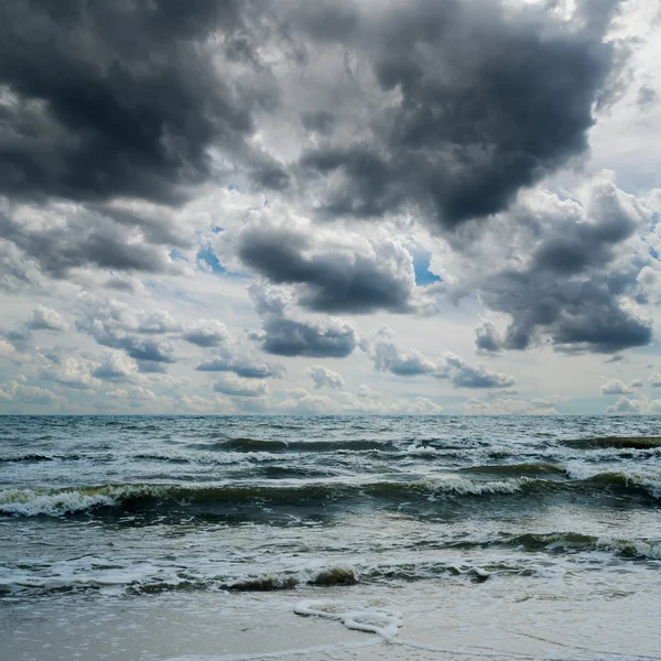 Stormy sky over dark sea — Stock Photo, Image