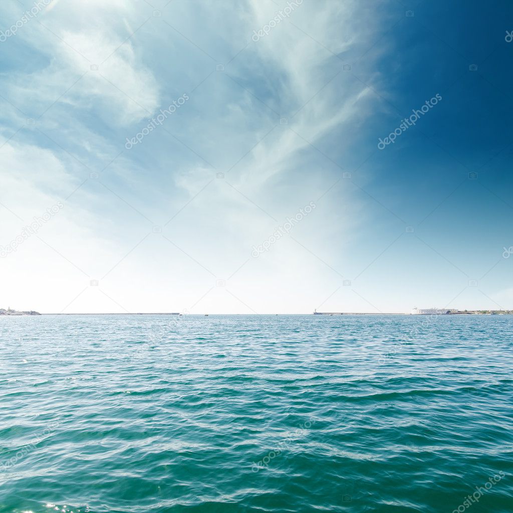 turquoise sea and clouds in blue sky