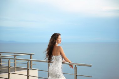 Beautiful Bride in wedding dress, outdoor portrait. Brunette ele