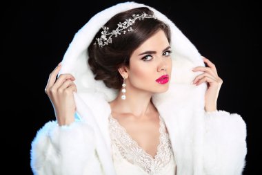 Wedding hairstyle. Winter Girl in fashion Fur Coat. Makeup. Luxu clipart