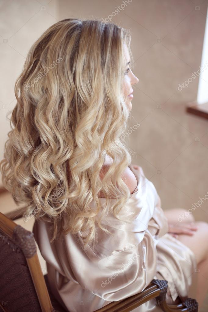 Long hair blonde curly secretary