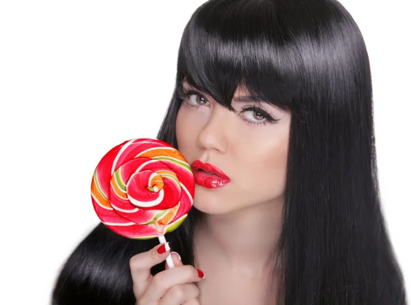 Sensuele meisje zuigen lolly. Rode lippen. Make-up. Brunette — Stockfoto