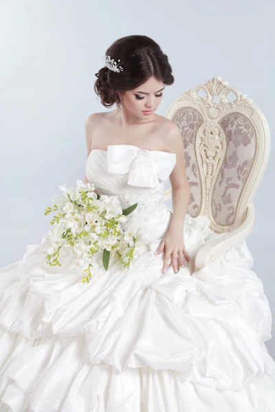 Bride. Beautiful brunette woman wearing in modern wedding dress Stock Photo