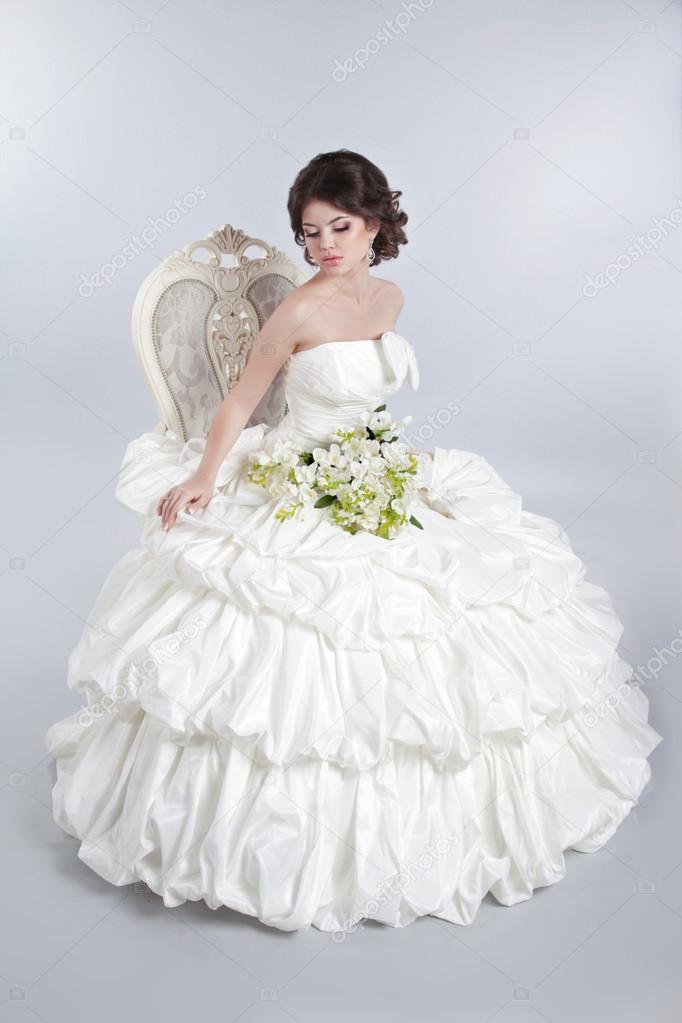 Beautiful attractive bride model wearing in wedding dress with v