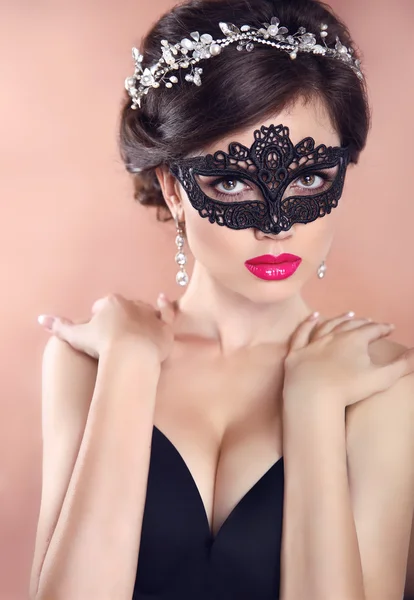 Elegant hairstyle. Beautiful Girl in black veil mask. Masquerade — Φωτογραφία Αρχείου