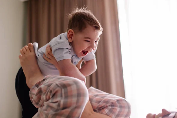 mom of special child plays with him. family with child cerebral palsy lives a normal life. Small moments of happiness real life. Disabled kid toddler laughs smiles. Love caring support.  Lifestyle