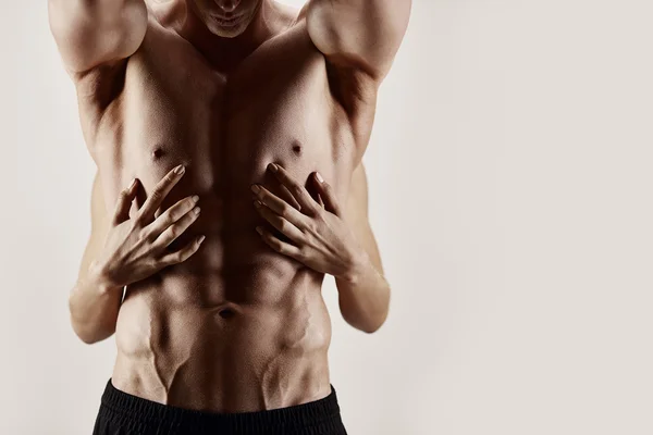 Hands and abs — Stock Photo, Image