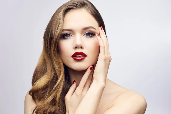 Red lips girl touching her face