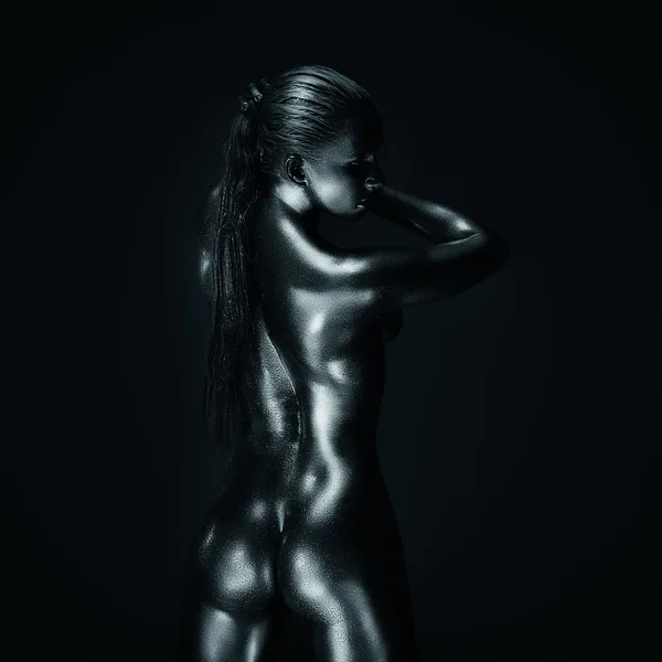 Lady in silver, back posing — Stock Photo, Image